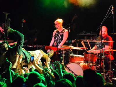 Lead singer crowd surfing