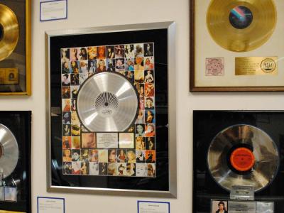 Gold and platinum record awards on a wall