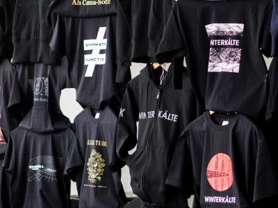 Display of t-shirts with band logos