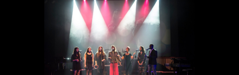 Students singing on stage