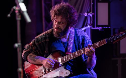 Guitarist playing in a local venue in Valencia.