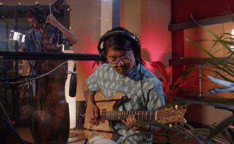 Guitarist recording at the AKSS recording stage of the Berklee Valencia campus.