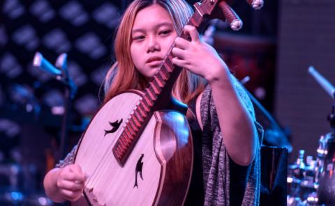 ZhongRuan player performing at a Berklee Showcase.
