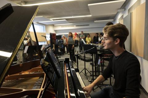 Student playing a Piano